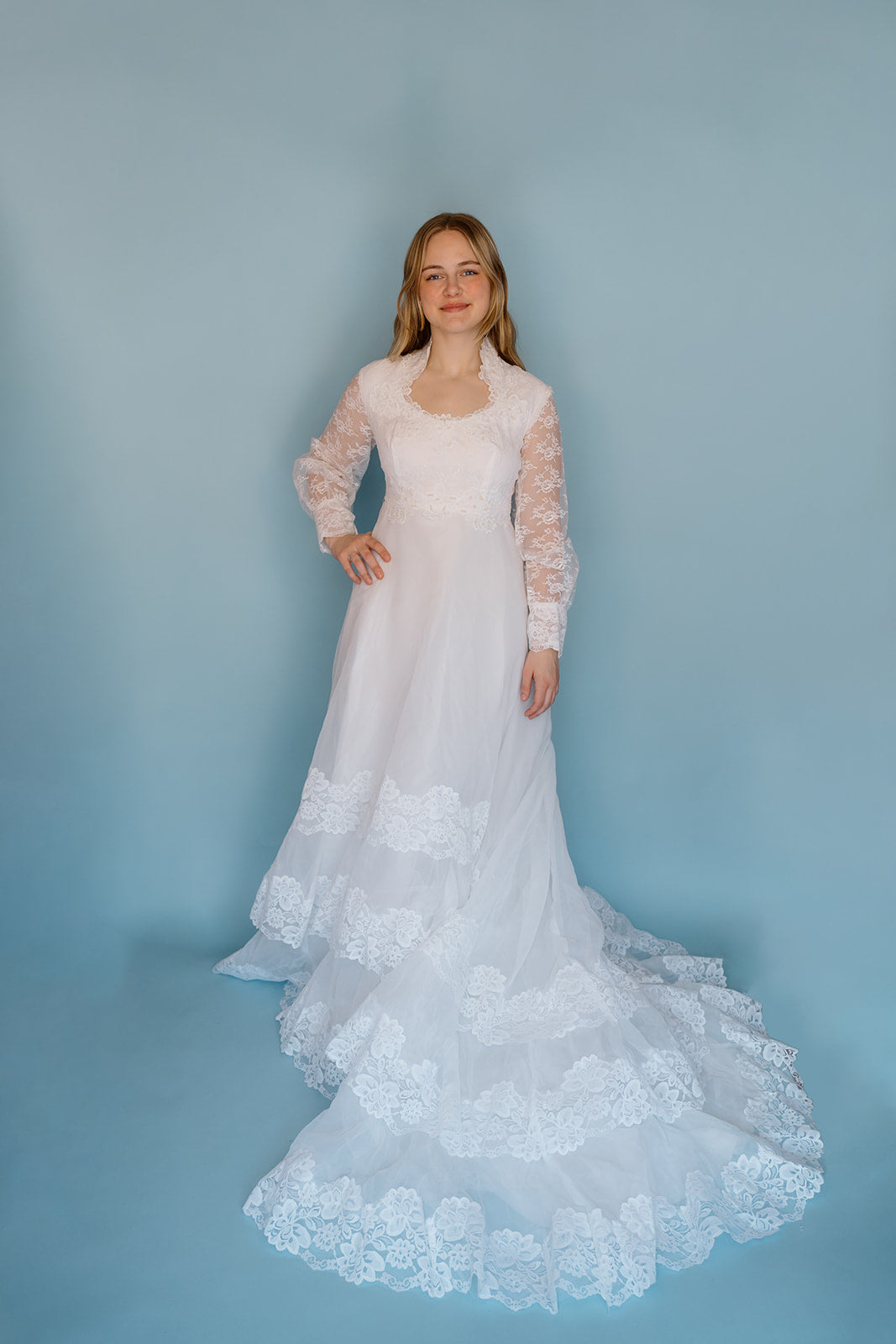 Morris: 1970s white, tiered skirt with tulle, long sleeves wedding dress