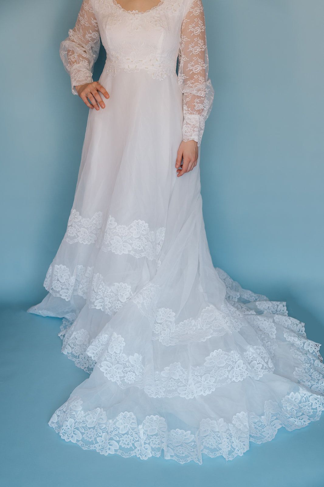 Morris: 1970s white, tiered skirt with tulle, long sleeves wedding dress