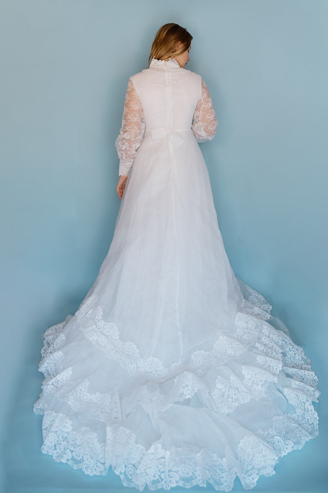 Morris: 1970s white, tiered skirt with tulle, long sleeves wedding dress