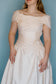 Quinn: 100% silk ivory ballgown with pearls and rouching