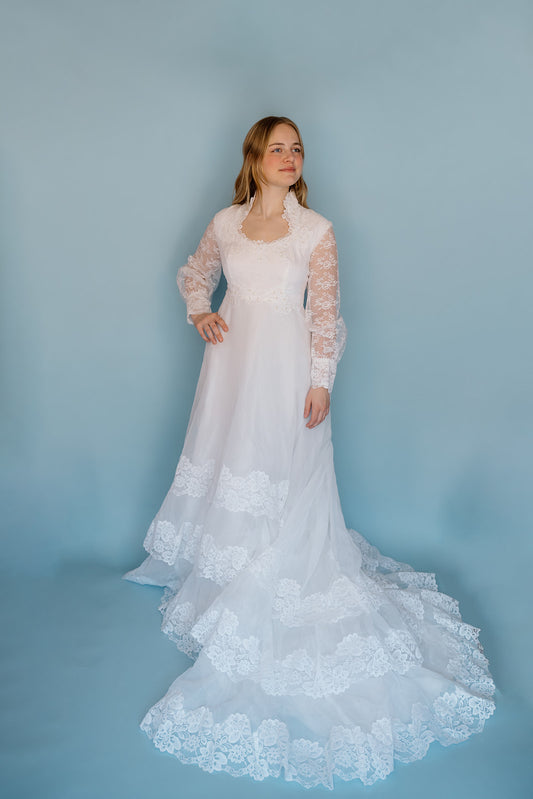 Morris: 1970s white, tiered skirt with tulle, long sleeves wedding dress