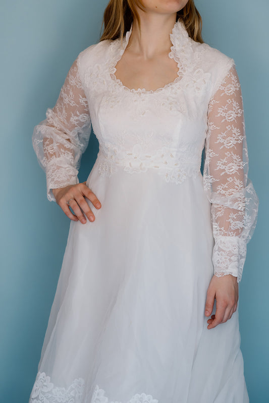 Morris: 1970s white, tiered skirt with tulle, long sleeves wedding dress